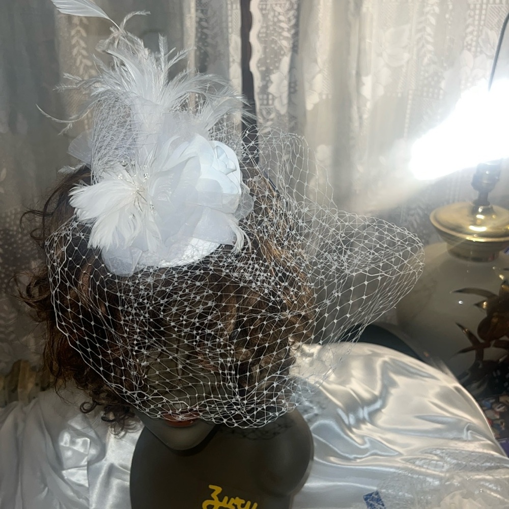 White clip on feather fascinator
